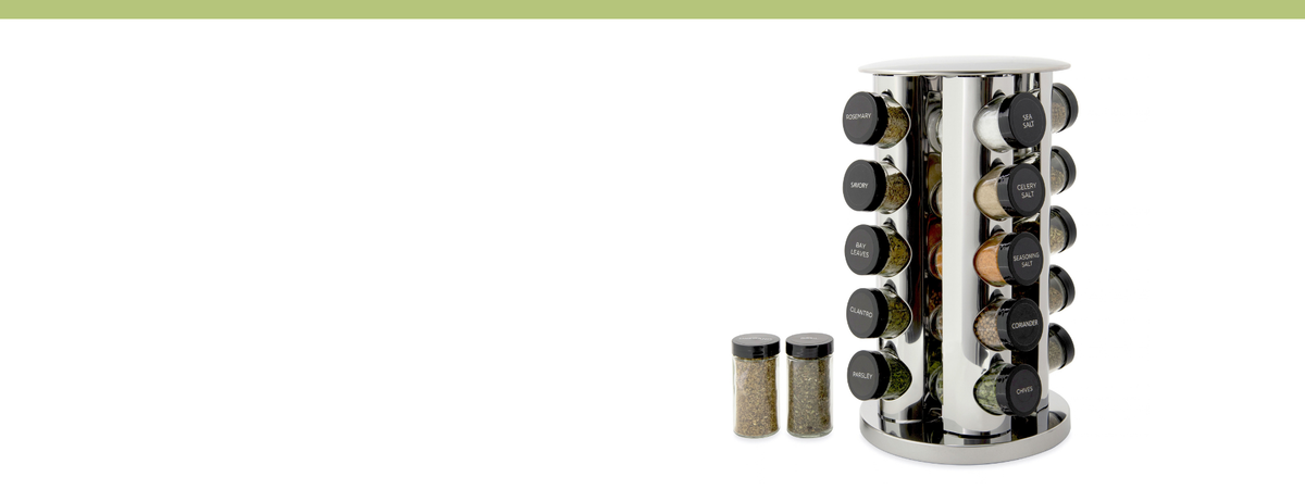 A stainless steel cylindrical spice rack with multiple rotating spice jars, shown on a white background with two additional spice jars placed in front.