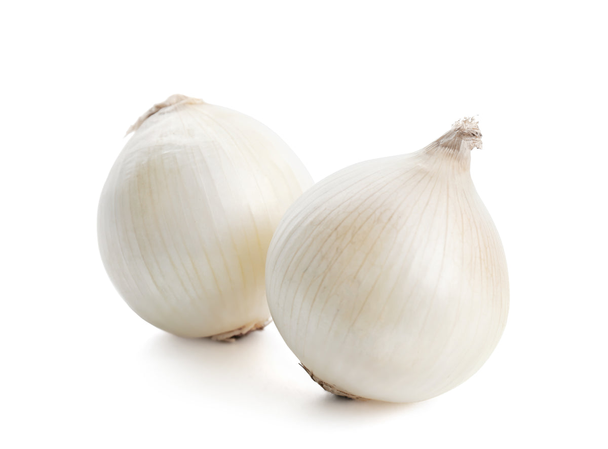 Three white onions with papery skins on white background