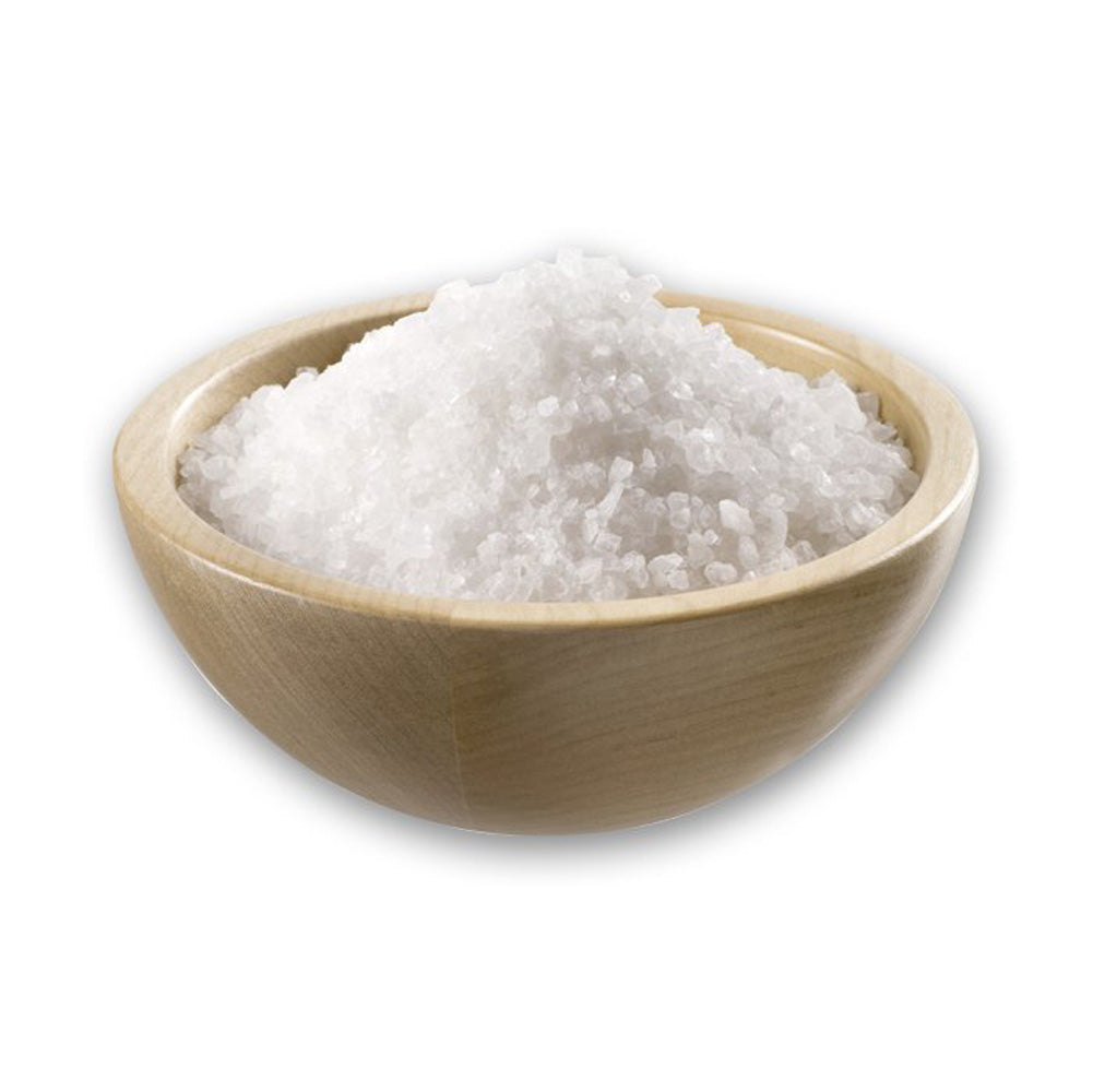 Sea salt crystals in a light wooden bowl